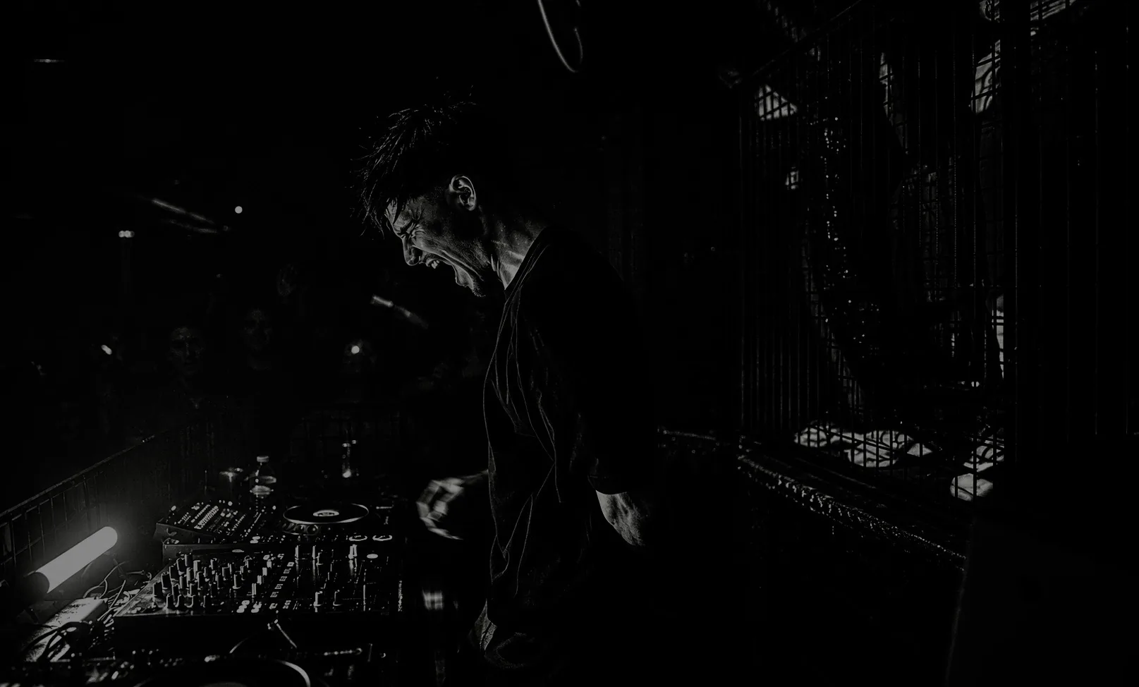 HERA shouting behind the decks, black and white